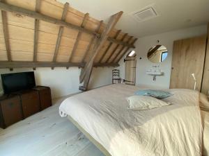 Säng eller sängar i ett rum på Guesthouse Graaf Jan