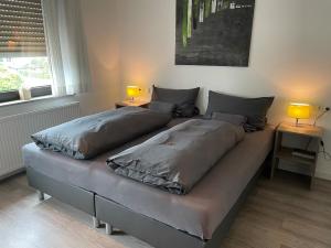Postel nebo postele na pokoji v ubytování Hotel Hegemann garni