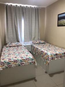 Posteľ alebo postele v izbe v ubytovaní Beach Way - Apartamento no Porto das Dunas