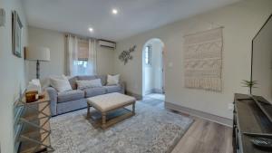 a living room with a couch and a table at The Suite in a historic carriage house in Kennett Square