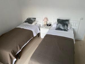 Łóżko lub łóżka w pokoju w obiekcie CASA BURRIANA