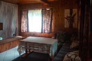 a room with a window and a table in it at Ptasi Śpiew in Futoma
