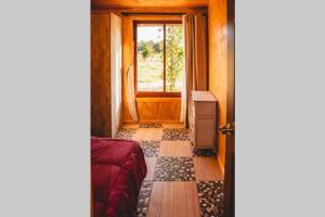 a room with a door and a window and a floor at Cunco casa de campo in Temuco