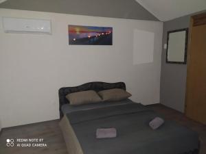 Кровать или кровати в номере Lenilenii Bungalows