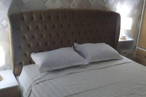 En eller flere senger på et rom på Luxury apartment at Jardin Carthage Tunis