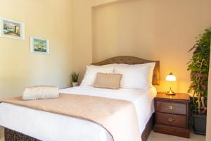 Ένα ή περισσότερα κρεβάτια σε δωμάτιο στο La Maison di Angelo Apartment Zakynthos Island