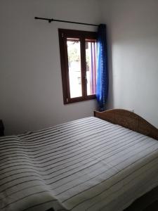Cama ou camas em um quarto em Appartamento al centro di Budoni