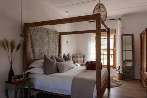 Ένα ή περισσότερα κρεβάτια σε δωμάτιο στο De Goede Hoop Farmstead