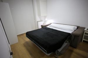Llit o llits en una habitació de La Confiança Rooms