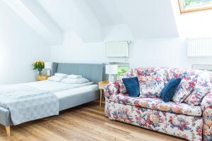 Posteľ alebo postele v izbe v ubytovaní Apartament Piastowska