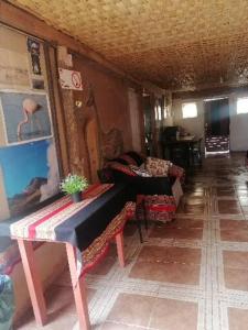 a living room with a couch and a table at La Casa Blanca in San Pedro de Atacama