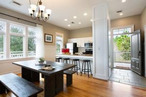 a kitchen with a table and chairs in a room at Eagle Cottages at Gulf State Park in Gulf Shores