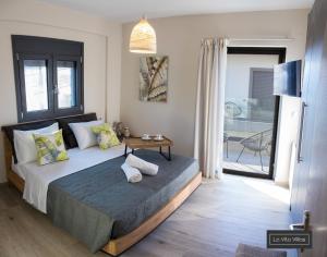 Postel nebo postele na pokoji v ubytování La Vita Villas + 37 fotografií