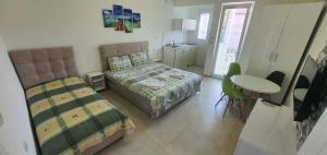 Postel nebo postele na pokoji v ubytování Antonio Apartments + 37 fotografií