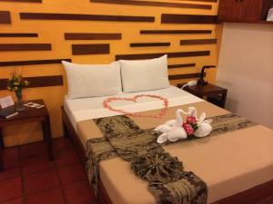 Posteľ alebo postele v izbe v ubytovaní Acacia Tree Garden Hotel