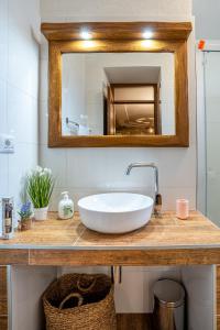 a bathroom with a white sink and a mirror at Apartment Jurasić in Orlec +34 photos