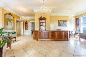 a large room with a large wooden cabinet in the middle at Best Western Walton Park Hotel in Clevedon