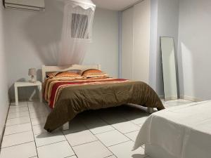 Postel nebo postele na pokoji v ubytování La villa bleue