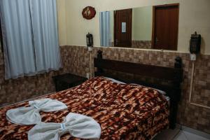 Кровать или кровати в номере Pousada Campo Alegre