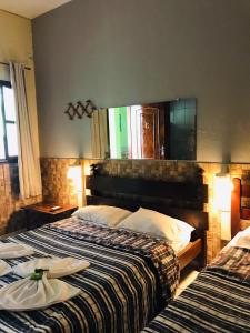 Кровать или кровати в номере Pousada Campo Alegre