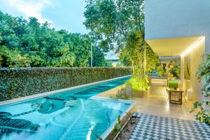 a swimming pool in the middle of a house at Private pool apartment for groups in Tulum