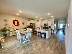 a kitchen and living room with a table and chairs at Beach Room, for wonderful Vacation in Panama City Beach