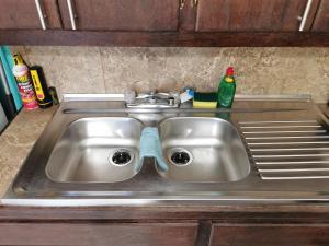 a kitchen sink with a pair of glasses on it at BELIZE TROPICAL DREAM VILLAS in San Pedro +126 photos