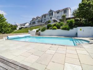 a swimming pool in the backyard of a house at 2 Garden Apartment in Kingsbridge