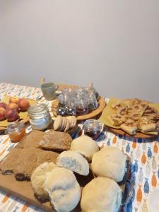 a table with bread and other foods on it at Ca' del Rì in Gargnano