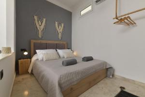 Ένα ή περισσότερα κρεβάτια σε δωμάτιο στο Centrale Apartment Symi