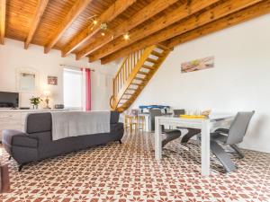 a living room with a couch and a table at Gîte Saint-Viaud, 3 pièces, 4 personnes - FR-1-306-1190 in Saint-Viaud