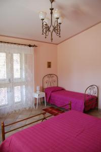 Postel nebo postele na pokoji v ubytování Cinisi 89 B&B + 16 fotografií