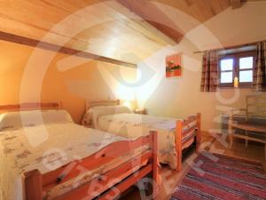 a bedroom with two beds in a room at Gîte Polignac, 3 pièces, 5 personnes - FR-1-582-117 in Polignac