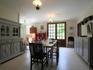 a kitchen with a table and chairs in a room at Gîte Alleyras, 4 pièces, 8 personnes - FR-1-582-244 in Alleyras