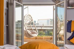 a room with a hammock on a balcony at Studio Acropolis in Athens