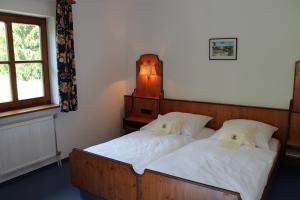 Postel nebo postele na pokoji v ubytování Hotel Höfler B&B