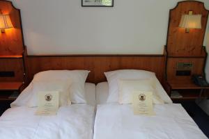 Postel nebo postele na pokoji v ubytování Hotel Höfler B&B