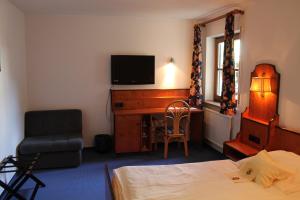Postel nebo postele na pokoji v ubytování Hotel Höfler B&B
