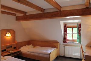 Postel nebo postele na pokoji v ubytování Hotel Höfler B&B