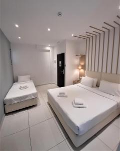 Postel nebo postele na pokoji v ubytování Elite Hotel
