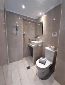 Koupelna v ubytování Elite Hotel