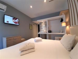 Postel nebo postele na pokoji v ubytování Elite Hotel