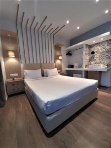 En eller flere senge i et værelse på Elite Hotel