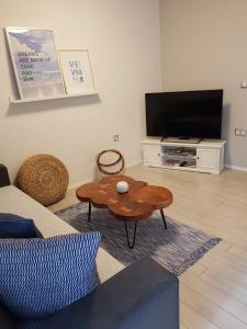 a living room with a couch and a coffee table at Apartmani EvaMaria in Poreč