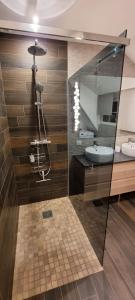 a bathroom with two sinks and a mirror at Appartement Grenier à sel Gentleman in Colmar