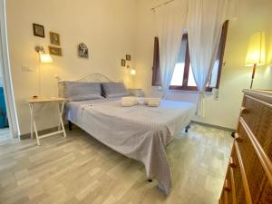 A bed or beds in a room at VILLA OASI a 50 mt dalla spiaggia