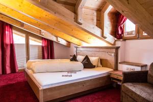 Postel nebo postele na pokoji v ubytování Hotel Garni Lawens