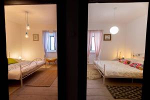 Postel nebo postele na pokoji v ubytování HOLIDAY HOME VINTAGE, Makarska - Lovreć