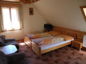 Posteľ alebo postele v izbe v ubytovaní Hotel Lesní dům