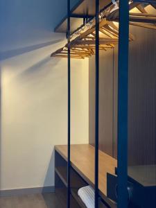 a room with a wooden shelf in a room at Demi Hotel in Sarandë